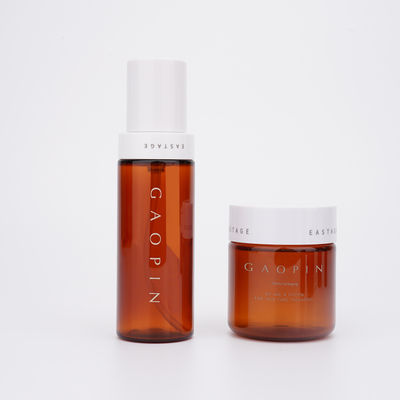 こはく色の化粧品のプラスチックびんは非有毒な無臭を包むSkincareをかわいがる